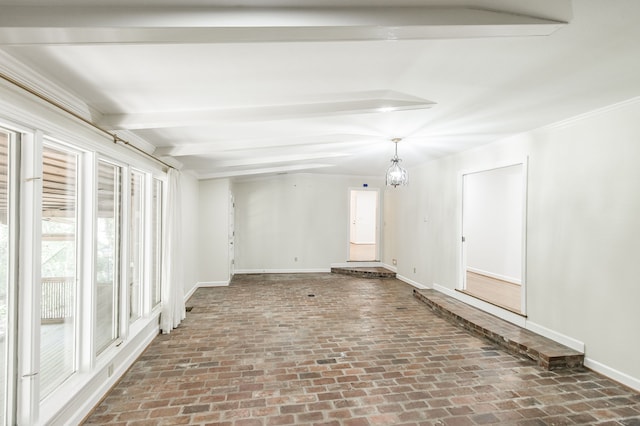 empty room featuring brick floor, baseboards, beam ceiling, and an inviting chandelier