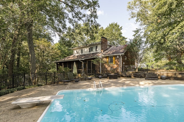 view of pool featuring fence, a fenced in pool, and a patio