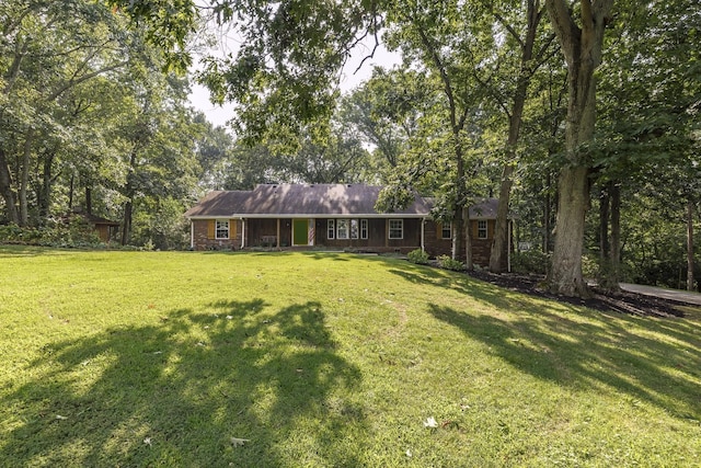 ranch-style house with a front lawn and brick siding