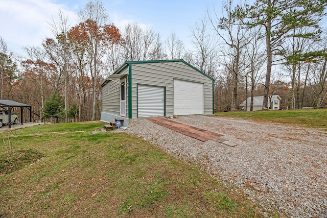 garage featuring a yard