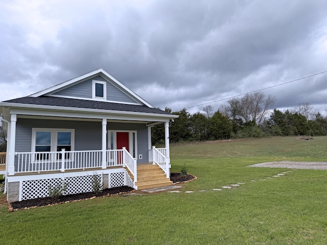 view of front of property with a porch and a front lawn