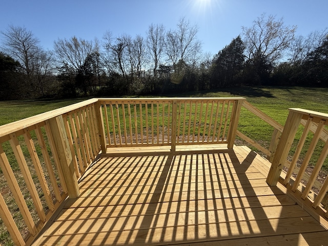 deck featuring a lawn