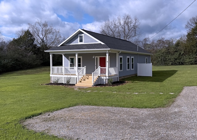 view of front of house with a front yard and a porch