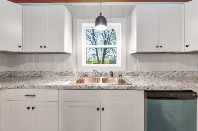 kitchen with pendant lighting, dishwasher, white cabinetry, and sink