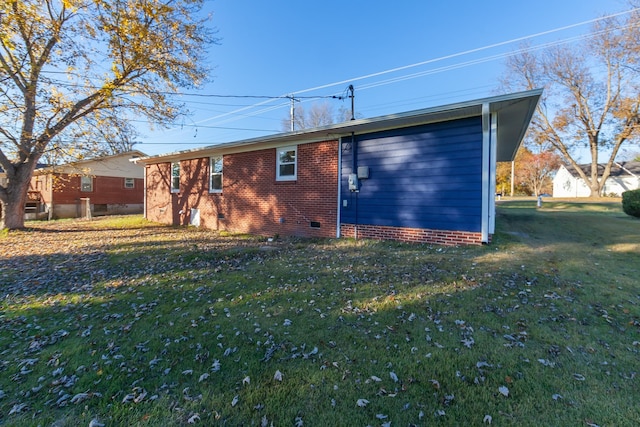 rear view of property with a yard