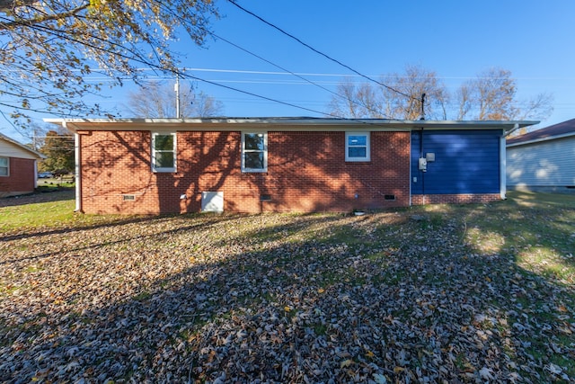 back of property featuring a yard