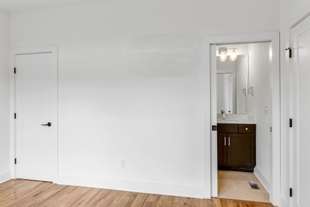 interior space with wood-type flooring and vanity