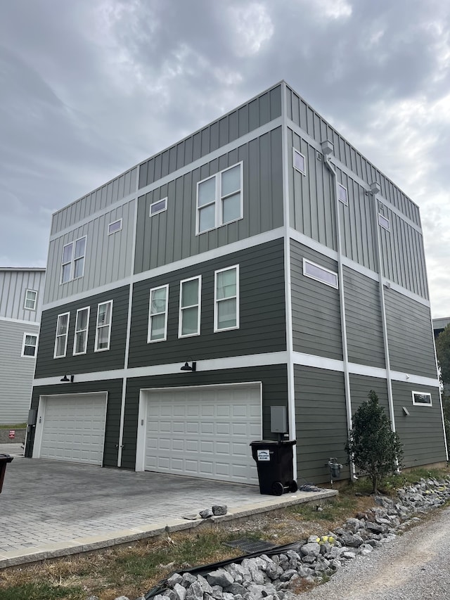 view of side of home featuring a garage