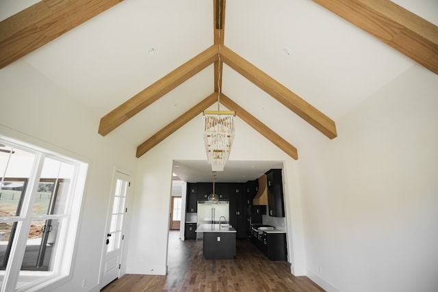 living room featuring a notable chandelier, beamed ceiling, dark hardwood / wood-style floors, and high vaulted ceiling