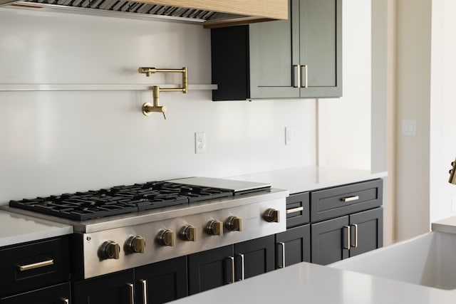 kitchen featuring range hood and stainless steel gas stovetop