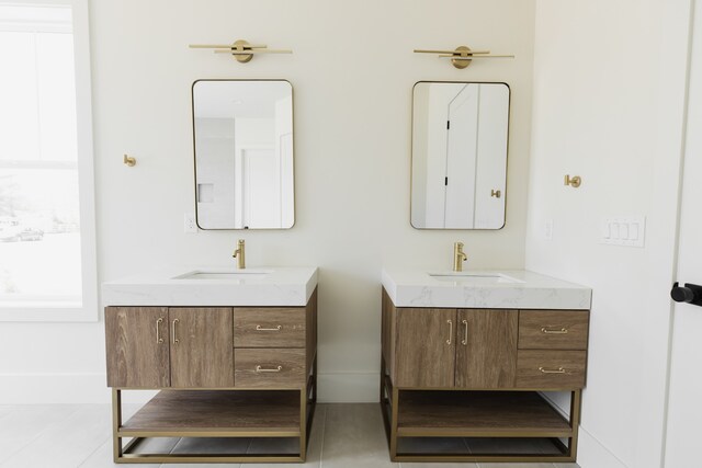 bathroom with tile patterned floors and vanity