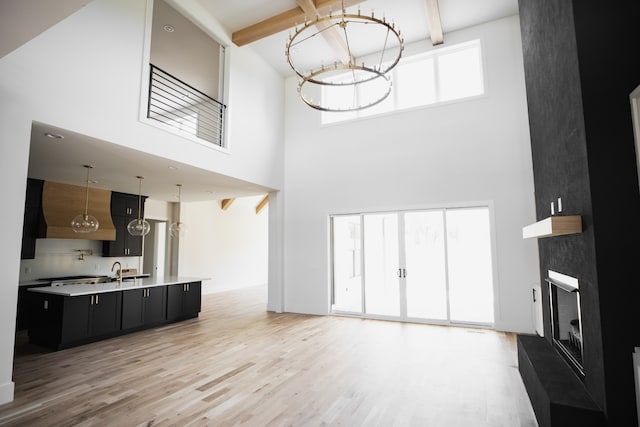 living room featuring a towering ceiling and a wealth of natural light