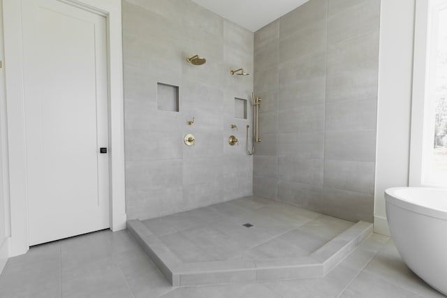 bathroom featuring tile patterned floors and separate shower and tub