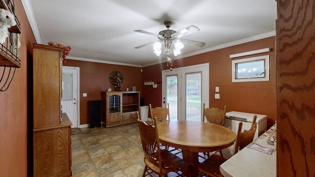 dining room featuring ceiling fan and crown molding