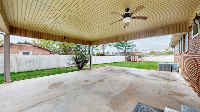 view of patio featuring a shed and central AC