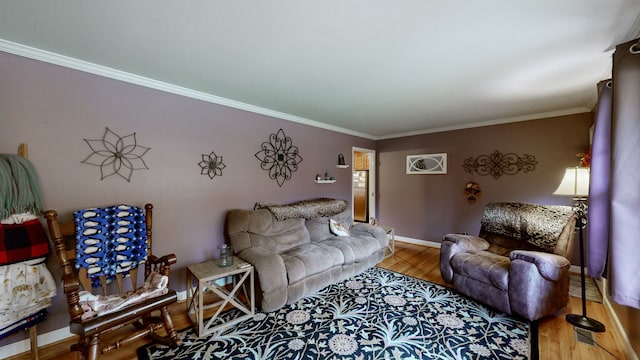 living room featuring wood-type flooring and ornamental molding