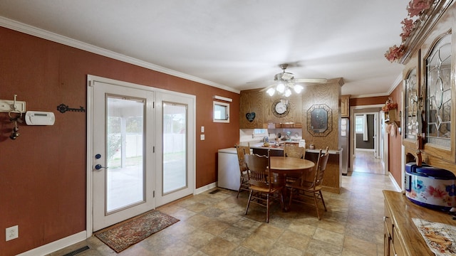 dining area with crown molding and ceiling fan