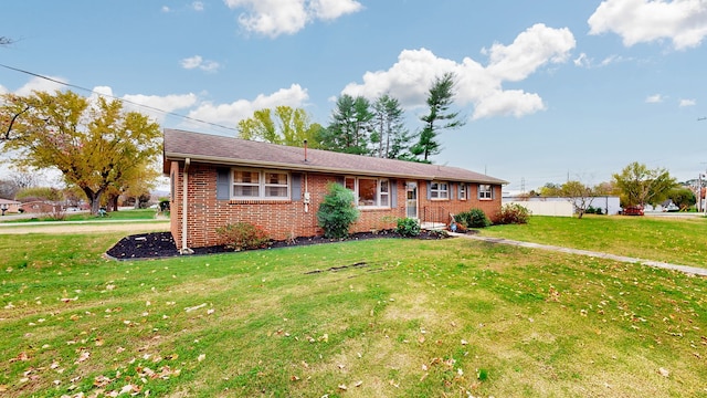 single story home with a front lawn