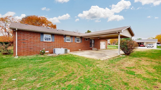 back of property with central AC unit and a yard