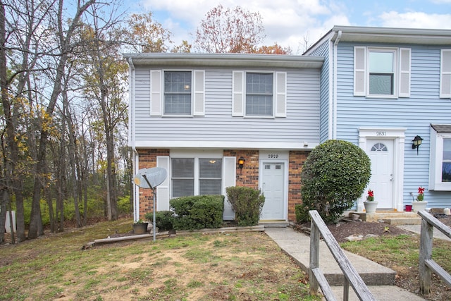 view of property featuring a front yard