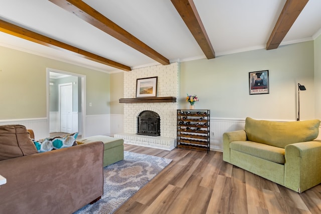 living room with hardwood / wood-style floors and crown molding