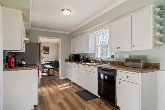 kitchen featuring sink, crown molding, wood-type flooring, black dishwasher, and white cabinets