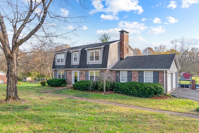 view of front of house with a garage and a front yard