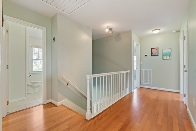 hallway with light wood-type flooring