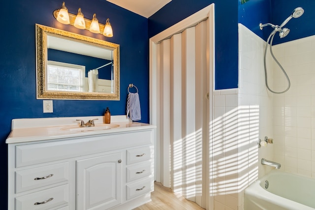 bathroom with shower / tub combo with curtain, vanity, and wood-type flooring