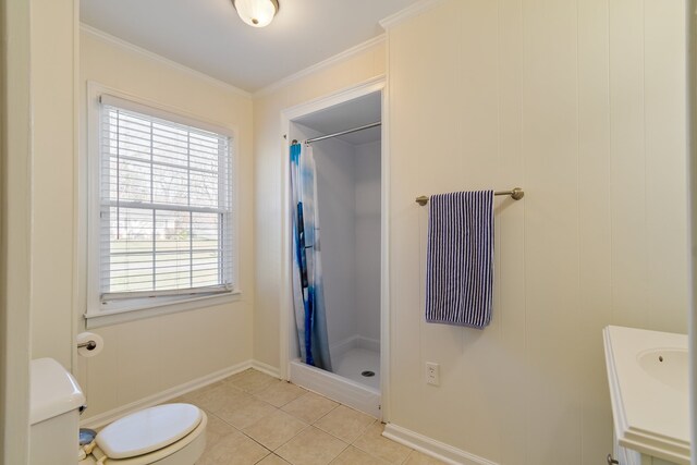 bathroom featuring tile patterned flooring, a wealth of natural light, toilet, and walk in shower