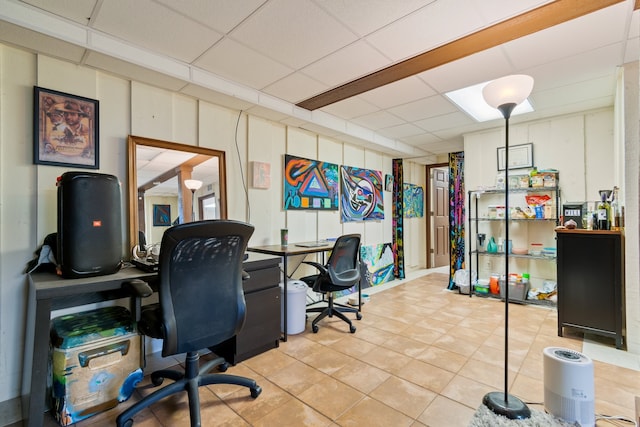 tiled office featuring a drop ceiling