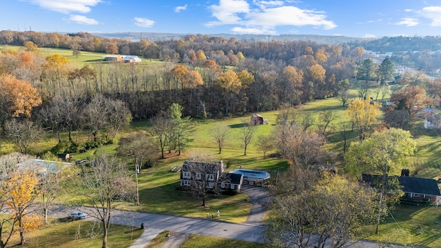 birds eye view of property with a rural view