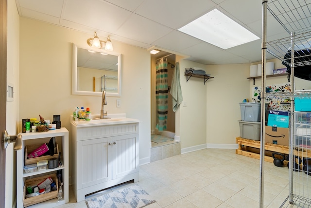 bathroom with vanity, tile patterned floors, and walk in shower