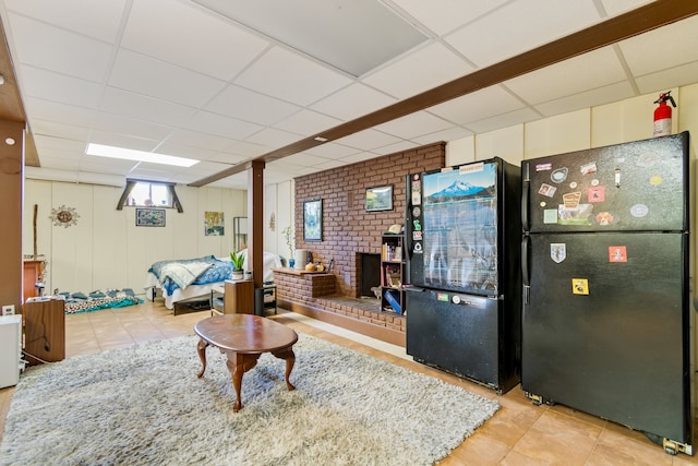 tiled living room with a drop ceiling