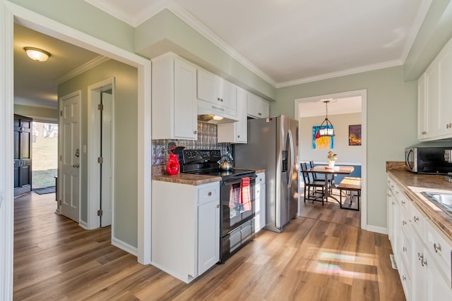 kitchen featuring pendant lighting, stainless steel appliances, backsplash, and white cabinets