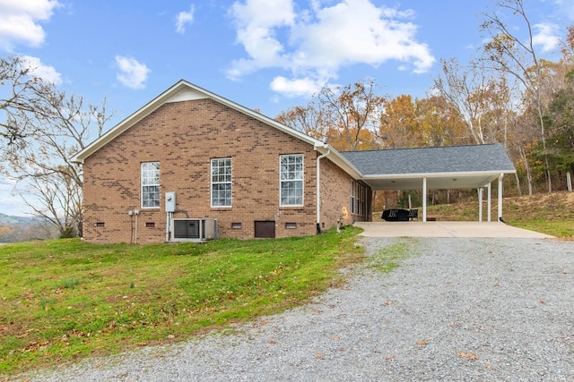 view of property exterior featuring a carport, central AC unit, and a yard