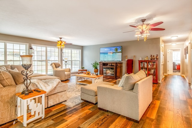 living room with ceiling fan and hardwood / wood-style flooring