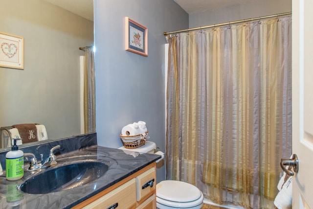 full bathroom featuring shower / bath combo, toilet, and vanity