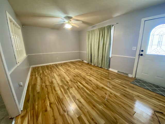 foyer entrance featuring ceiling fan and light hardwood / wood-style flooring