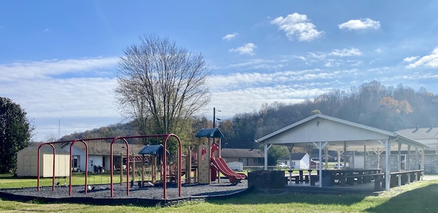 view of jungle gym with a lawn