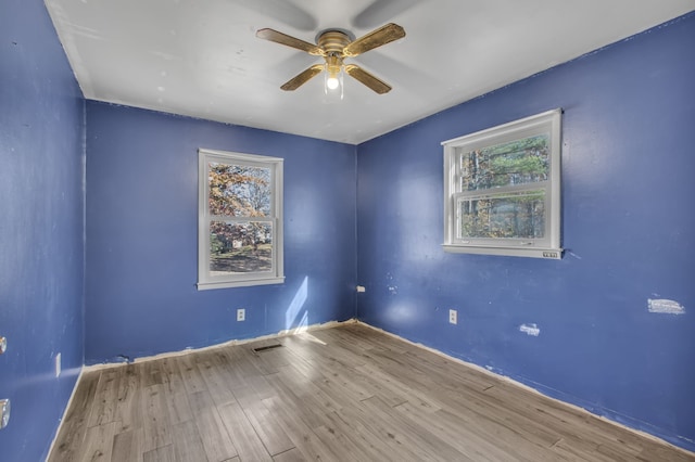 unfurnished room featuring ceiling fan and light hardwood / wood-style floors