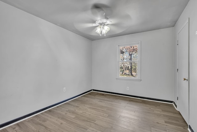 empty room featuring light hardwood / wood-style floors and ceiling fan