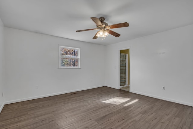 spare room featuring ceiling fan and wood-type flooring