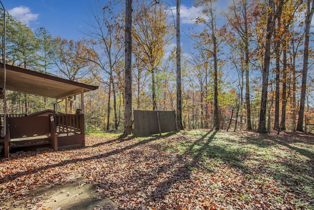 view of yard featuring a wooden deck