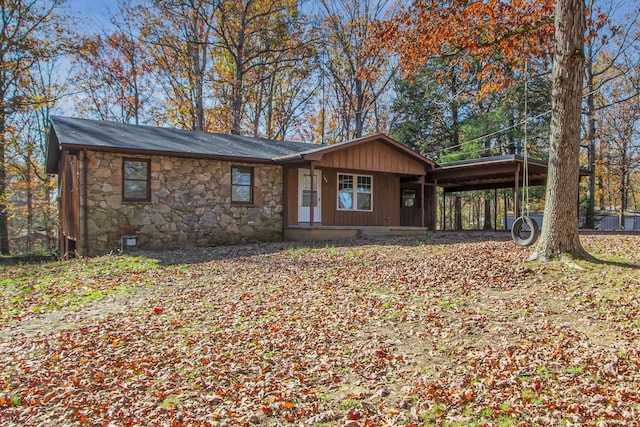 ranch-style house with a carport