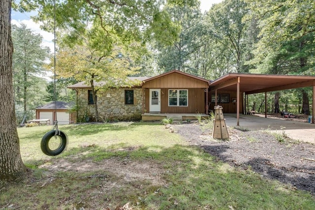 view of front facade with a carport and a front yard