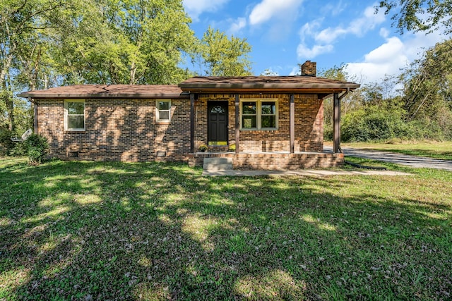 ranch-style house featuring a porch and a front lawn