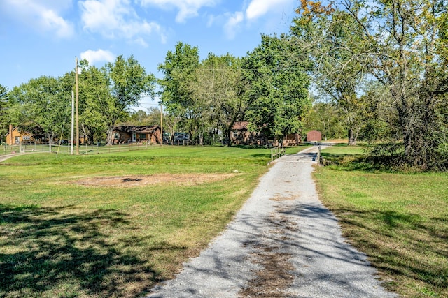 view of home's community with a lawn