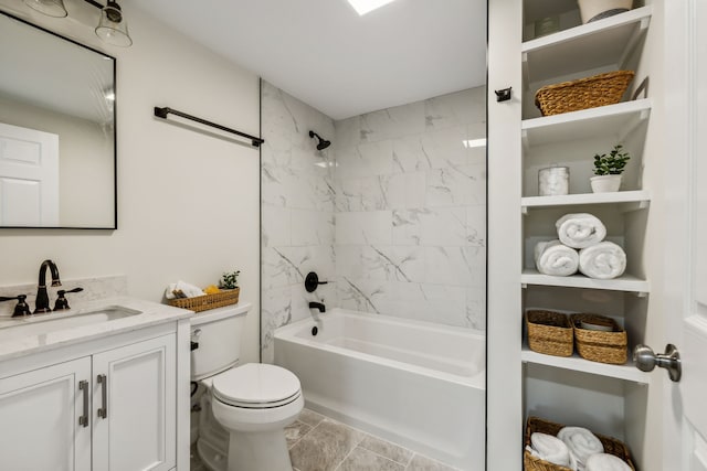 full bathroom with tile patterned floors, vanity, toilet, and tiled shower / bath