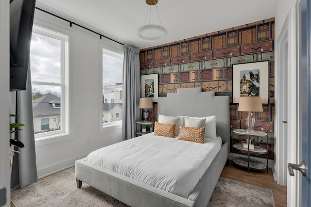 bedroom with light hardwood / wood-style flooring